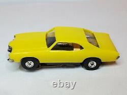 MEV 70 CYCLONE YELLOW, HO Slot Car, NOS AURORA CHASSIS (NEW IN BOX)